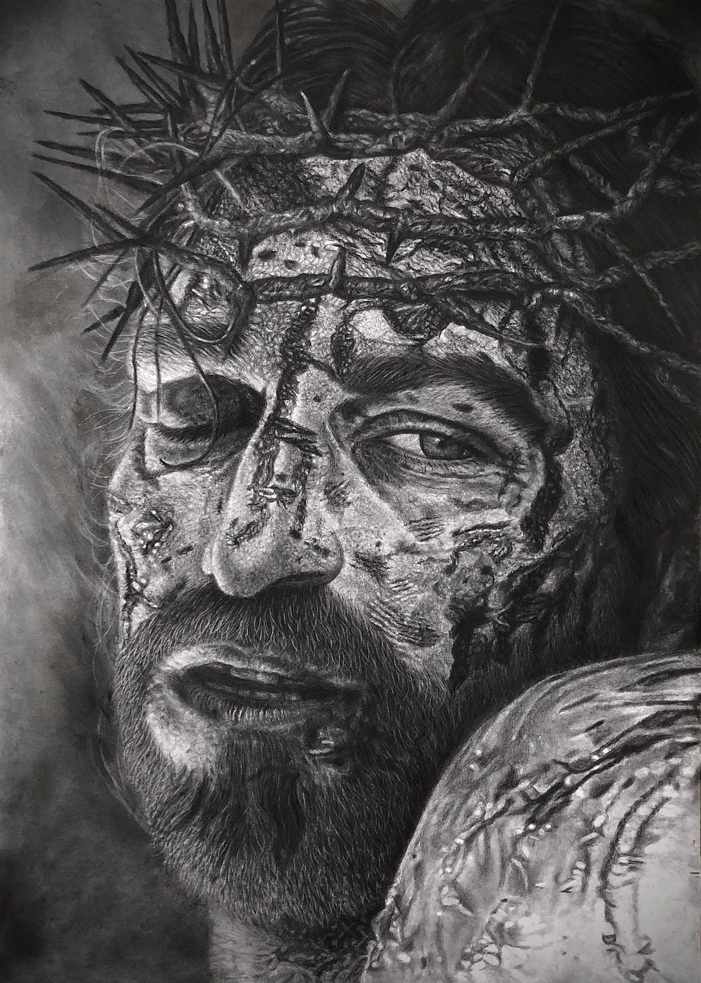 Black and white drawing of Jesus Christ wearing a crown of thorns on his head.